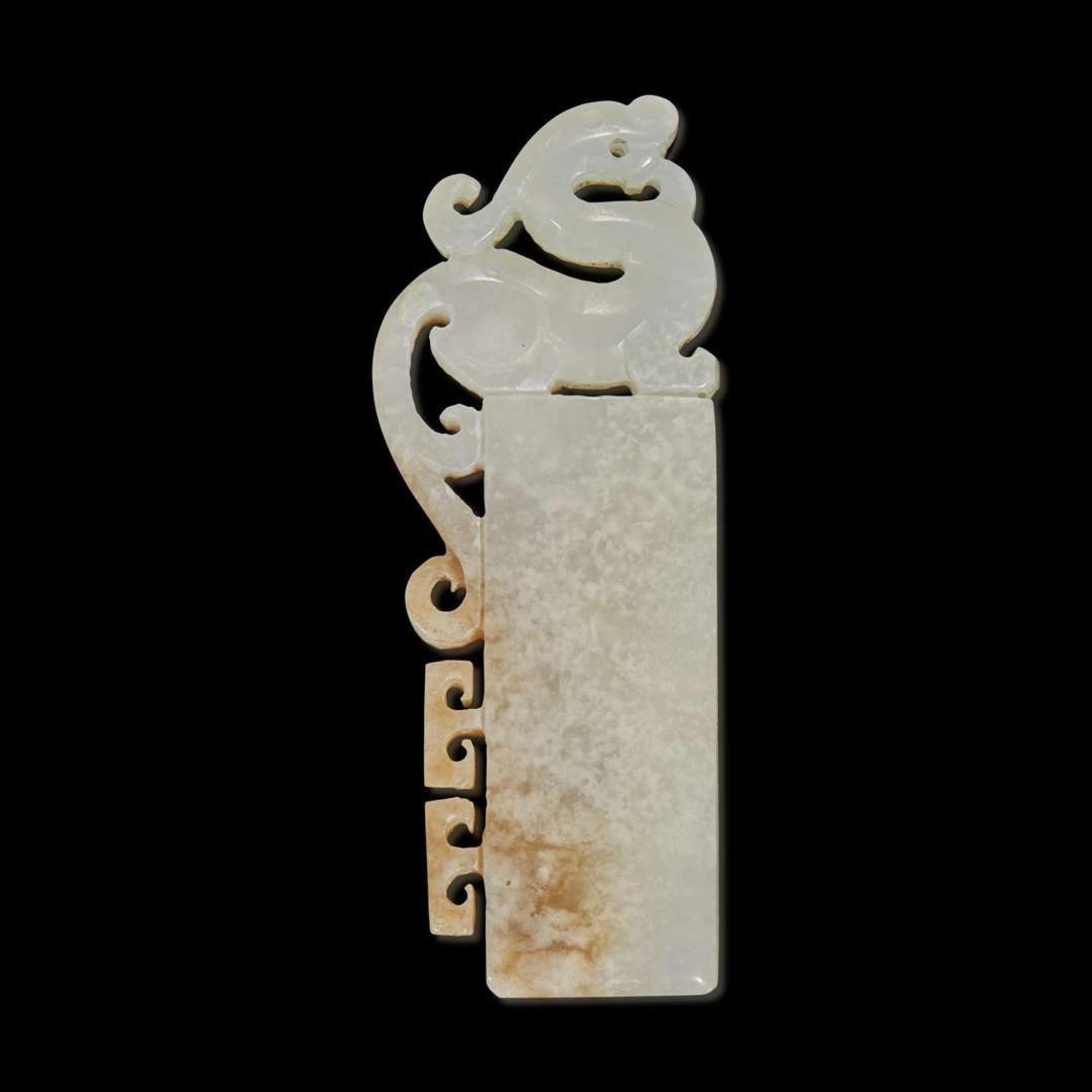 A Chinese white and beige archaistic pendant 仿古玉飾