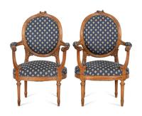 A Pair of Louis XVI Style Walnut Fauteuils