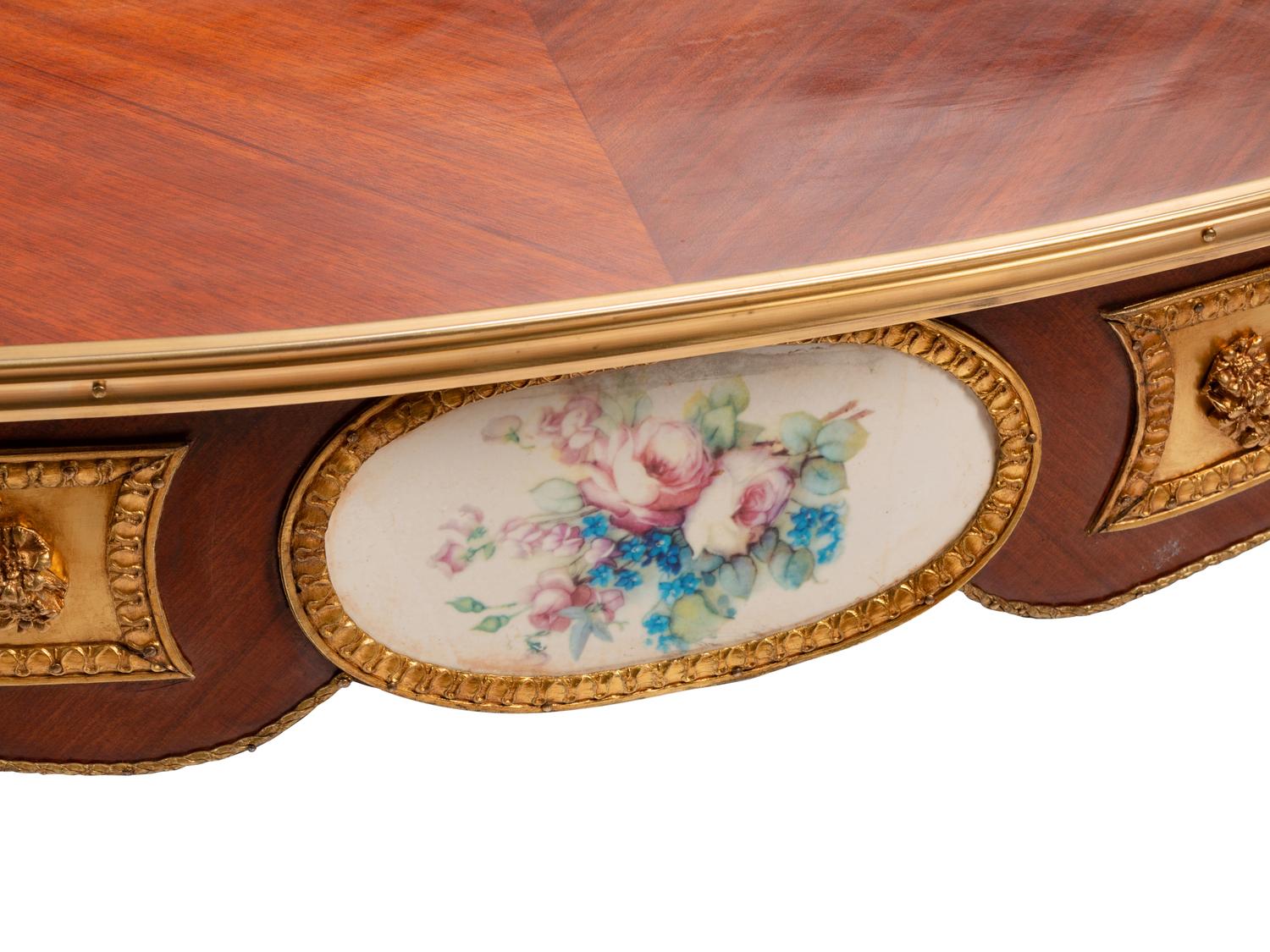 A Louis XV Style Gilt Bronze and Porcelain Mounted Marquetry Low Table