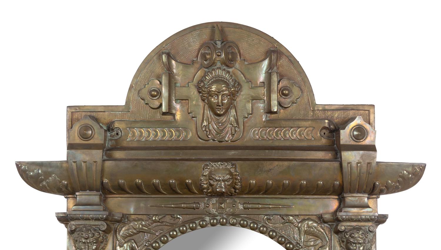 A Renaissance Revival Pressed Brass Mirror