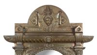 A Renaissance Revival Pressed Brass Mirror