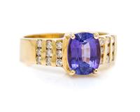 An 18 Karat Yellow Gold, Tanzanite and Diamond Ring, 4.30 dwts.