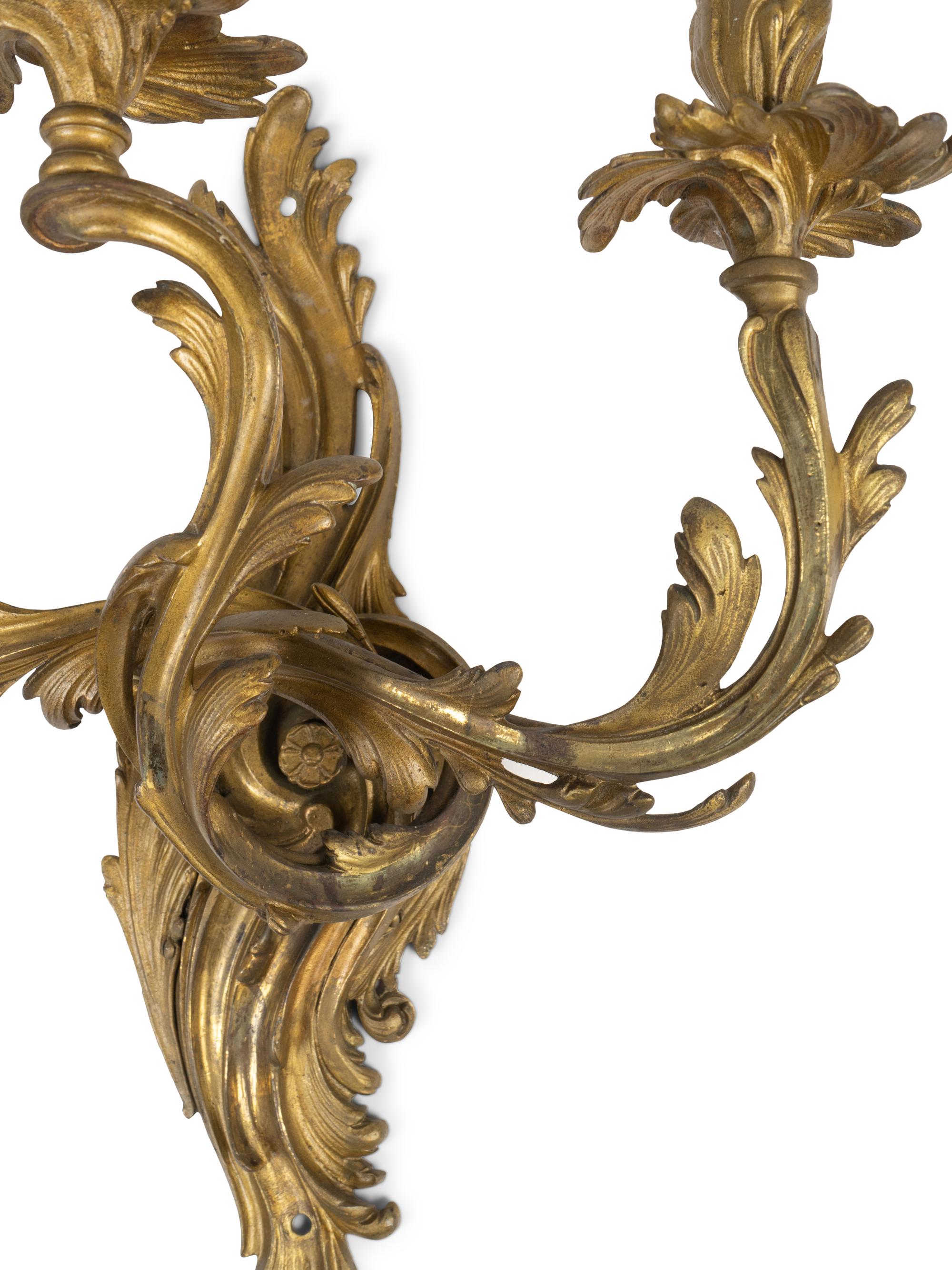 A Pair of Louis XV Style Gilt Bronze Three-Light Wall Sconces — 19TH/20TH CENTURY