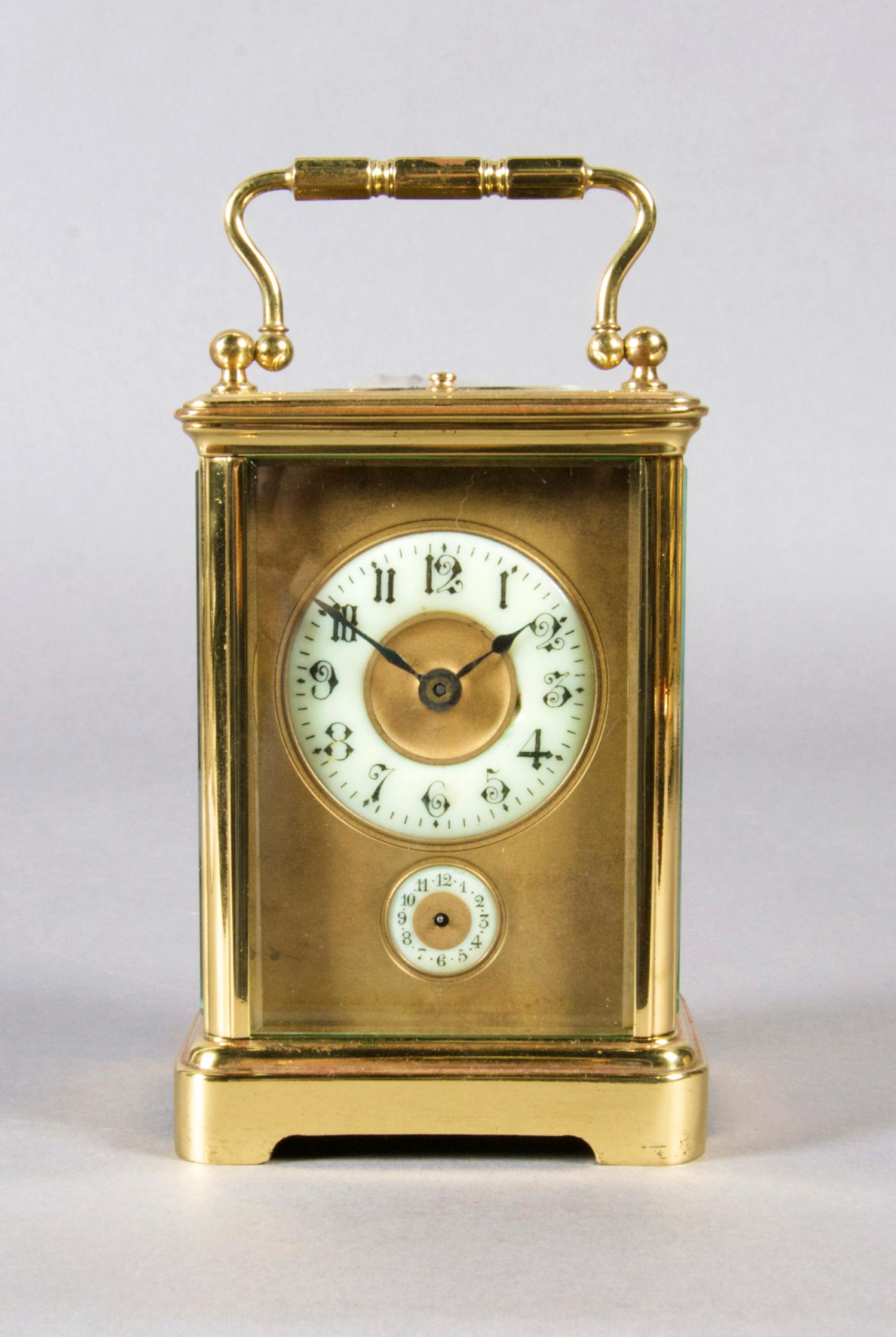 A French Brass Carriage Clock, Height over handle 6 1/4 inches.