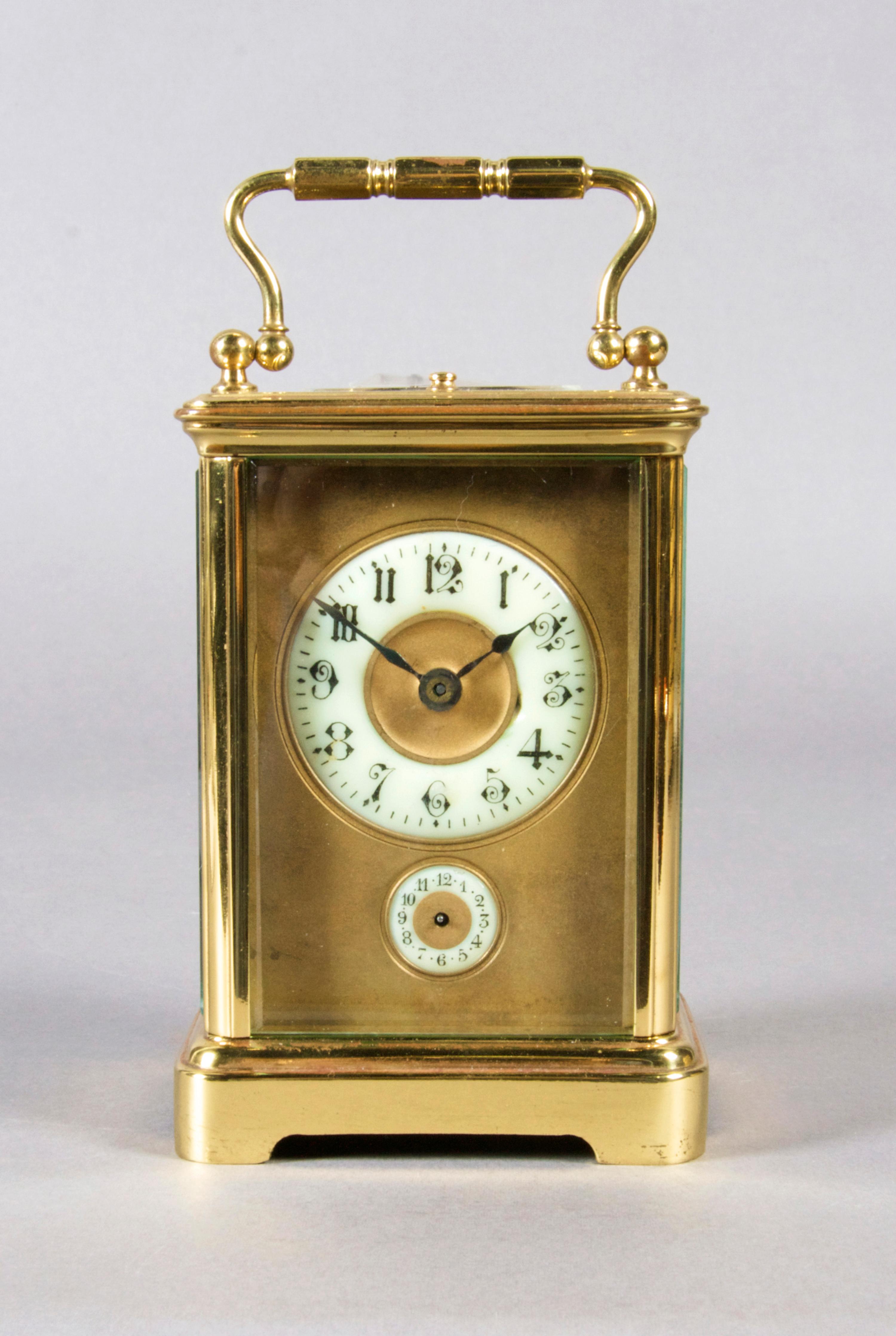 A French Brass Carriage Clock, Height over handle 6 1/4 inches.