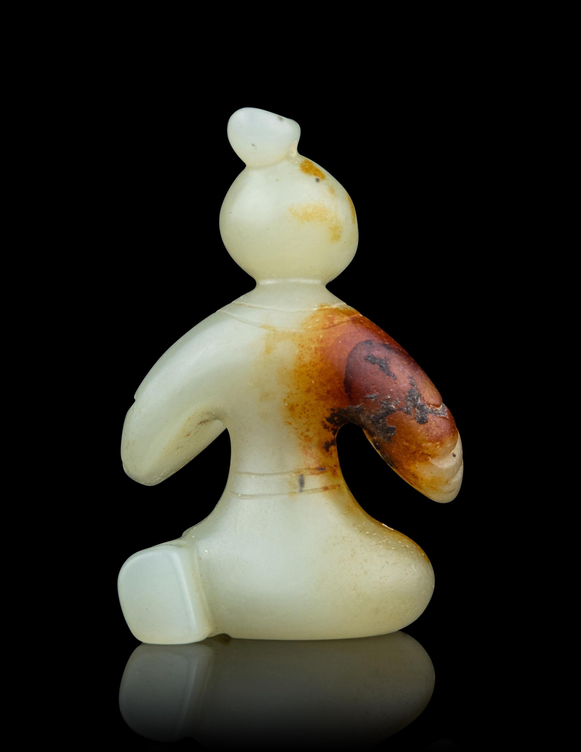 A Small Pale Celadon Jade Figure of a Man