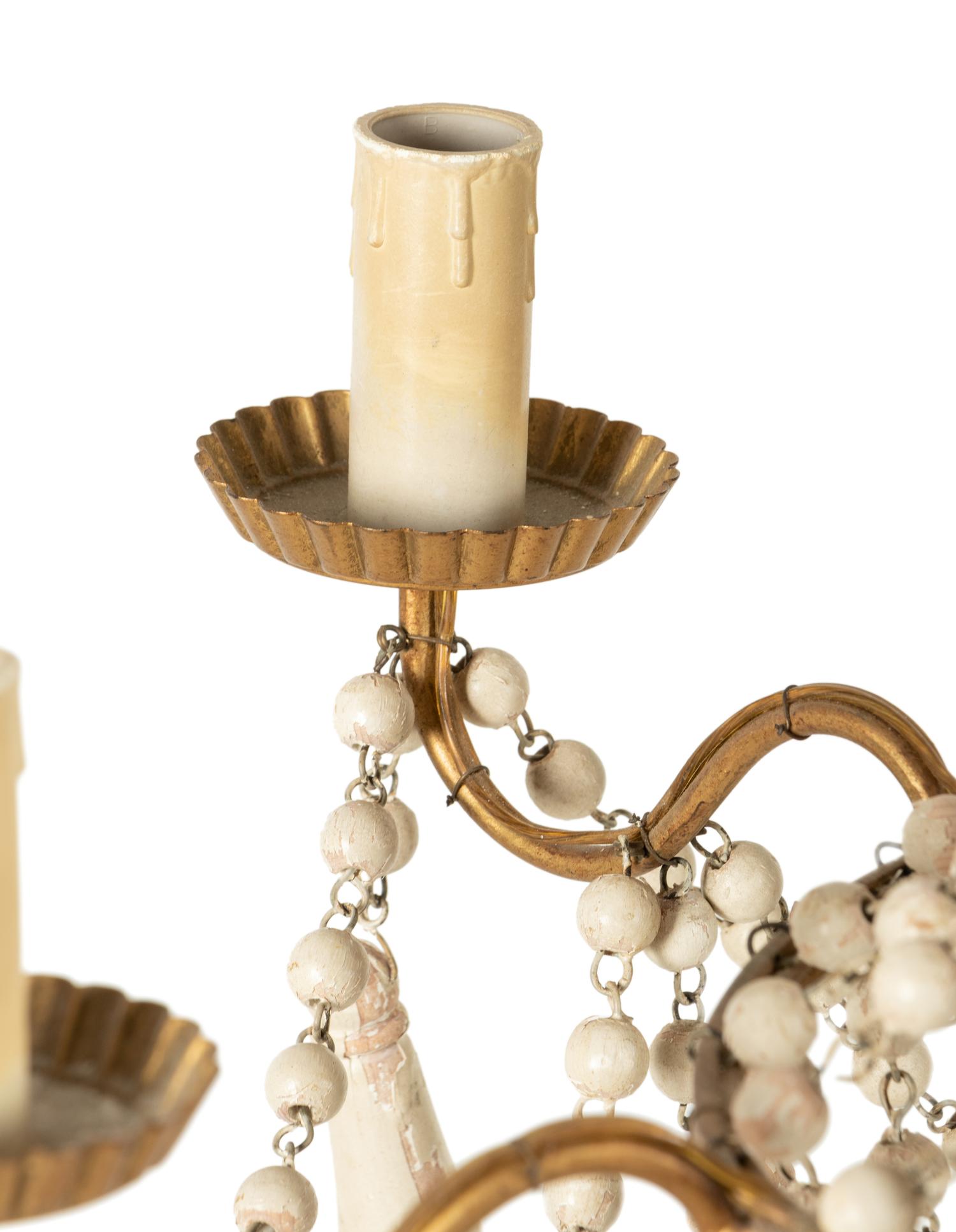 A Gilt Metal and Painted Wood Six-Light Chandelier