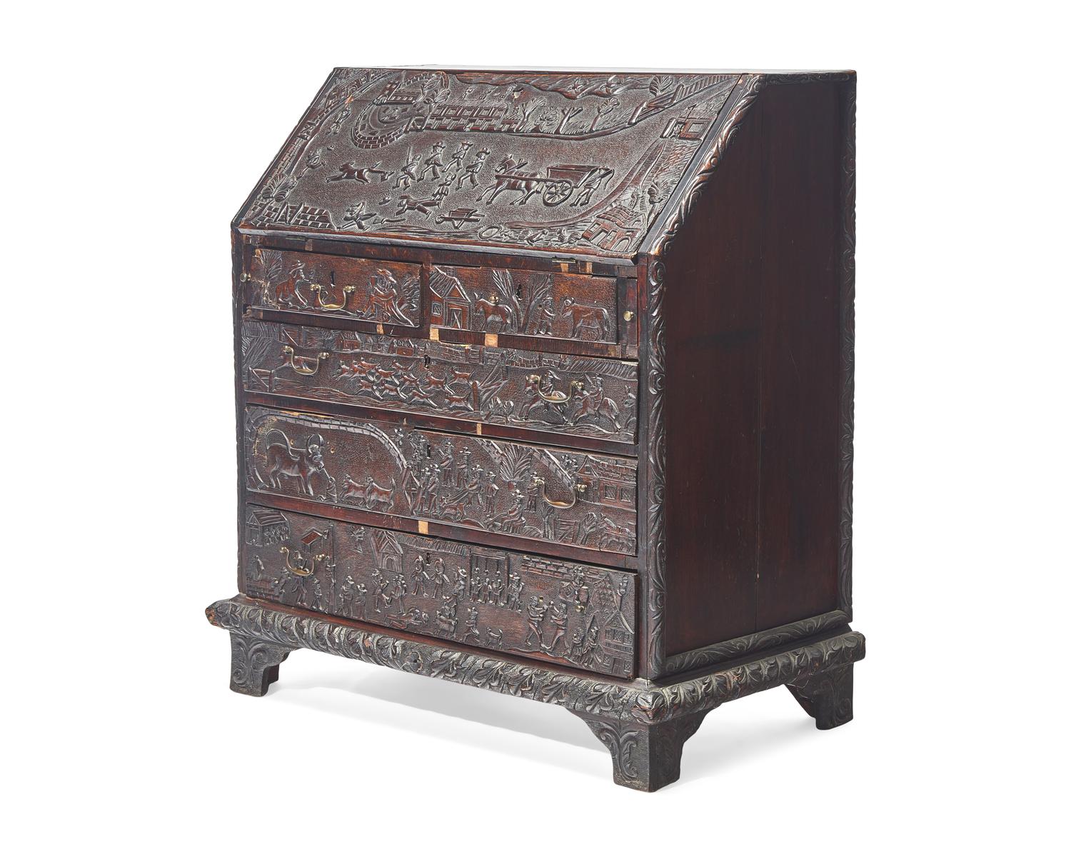 An English Relief-Carved Oak Slant-Front Desk
