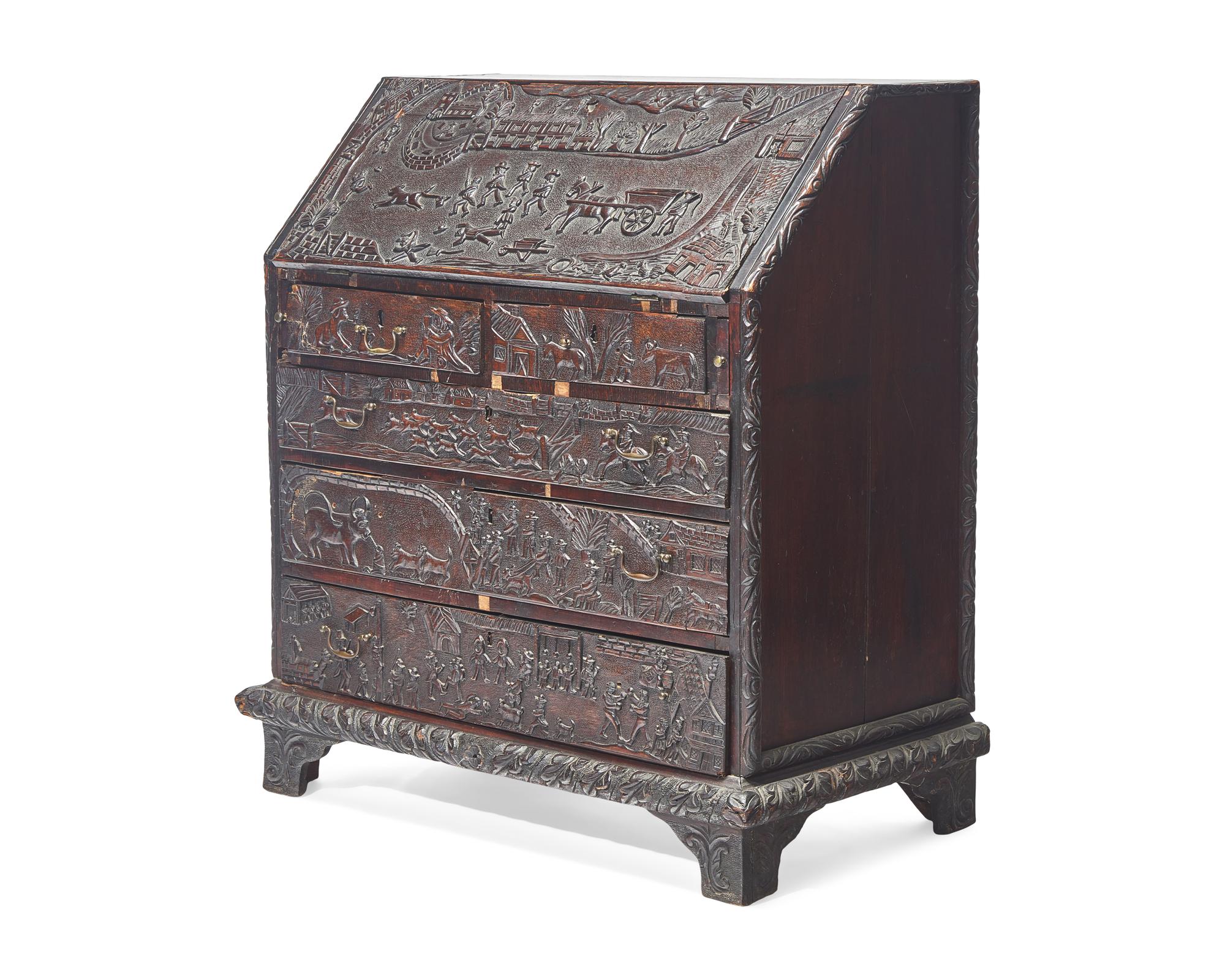 An English Relief-Carved Oak Slant-Front Desk