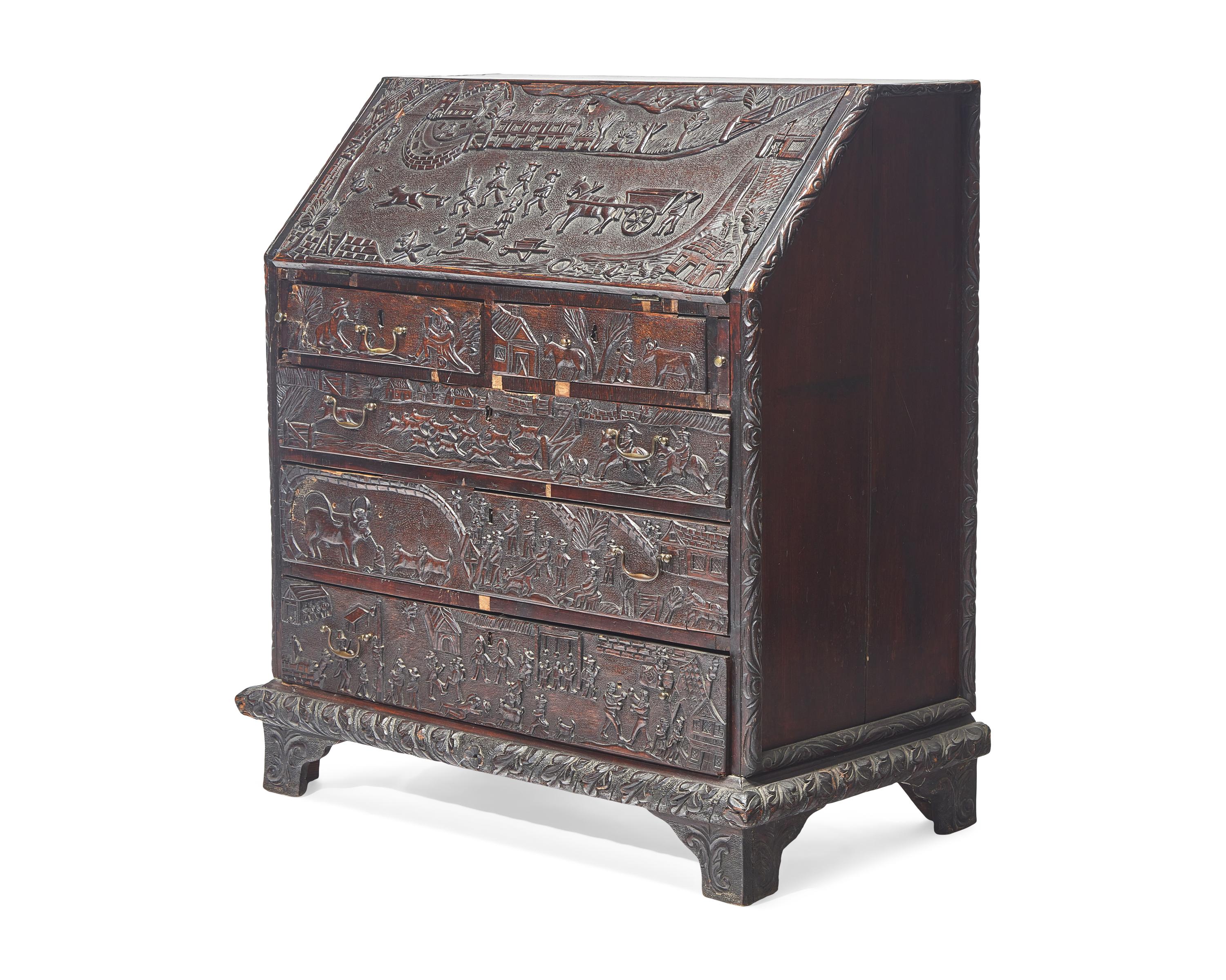An English Relief-Carved Oak Slant-Front Desk