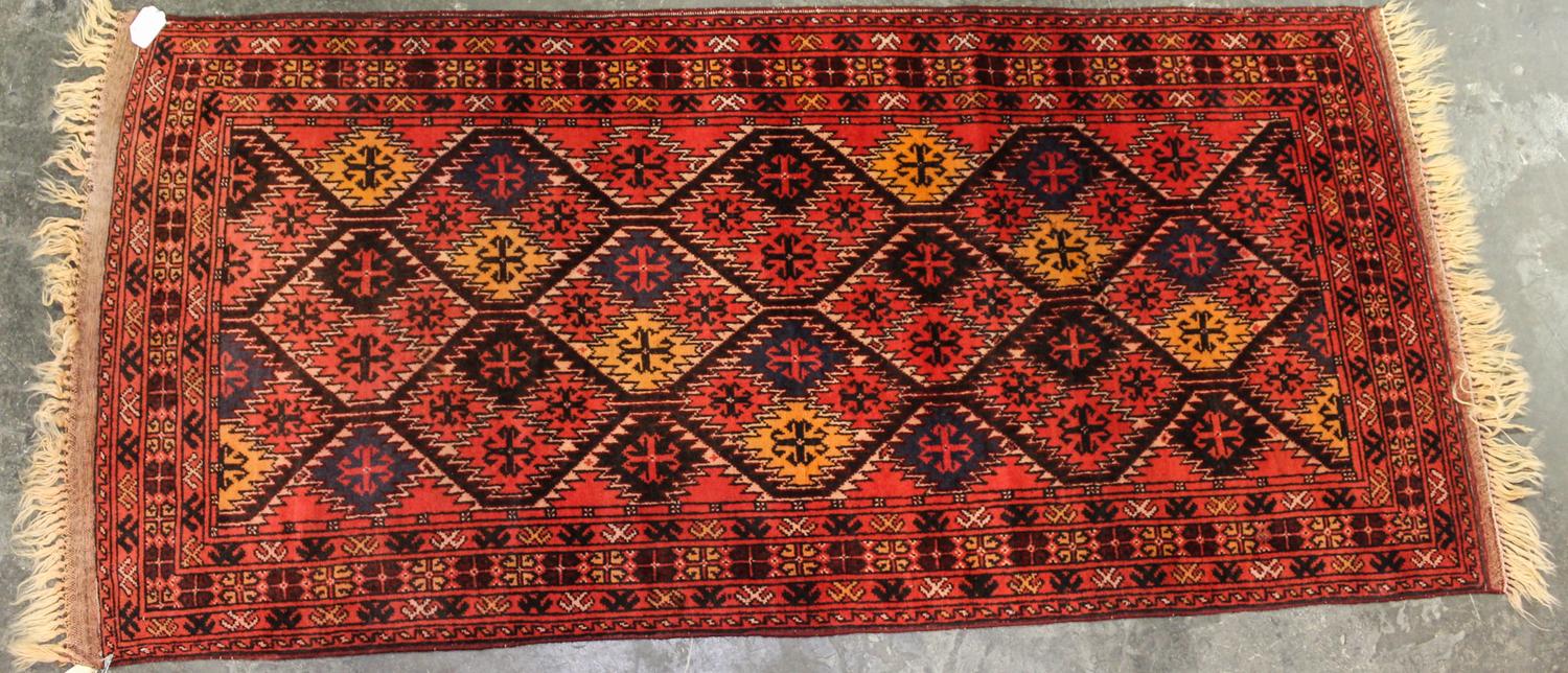 A Persian Style Wool Rug 6 feet 11 inches x 3 feet 2 inches. — 20TH CENTURY
