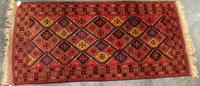 A Persian Style Wool Rug 6 feet 11 inches x 3 feet 2 inches. — 20TH CENTURY