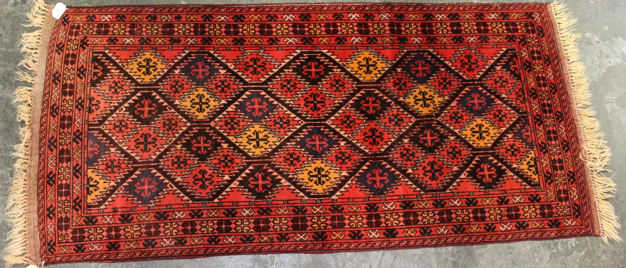 A Persian Style Wool Rug 6 feet 11 inches x 3 feet 2 inches. — 20TH CENTURY