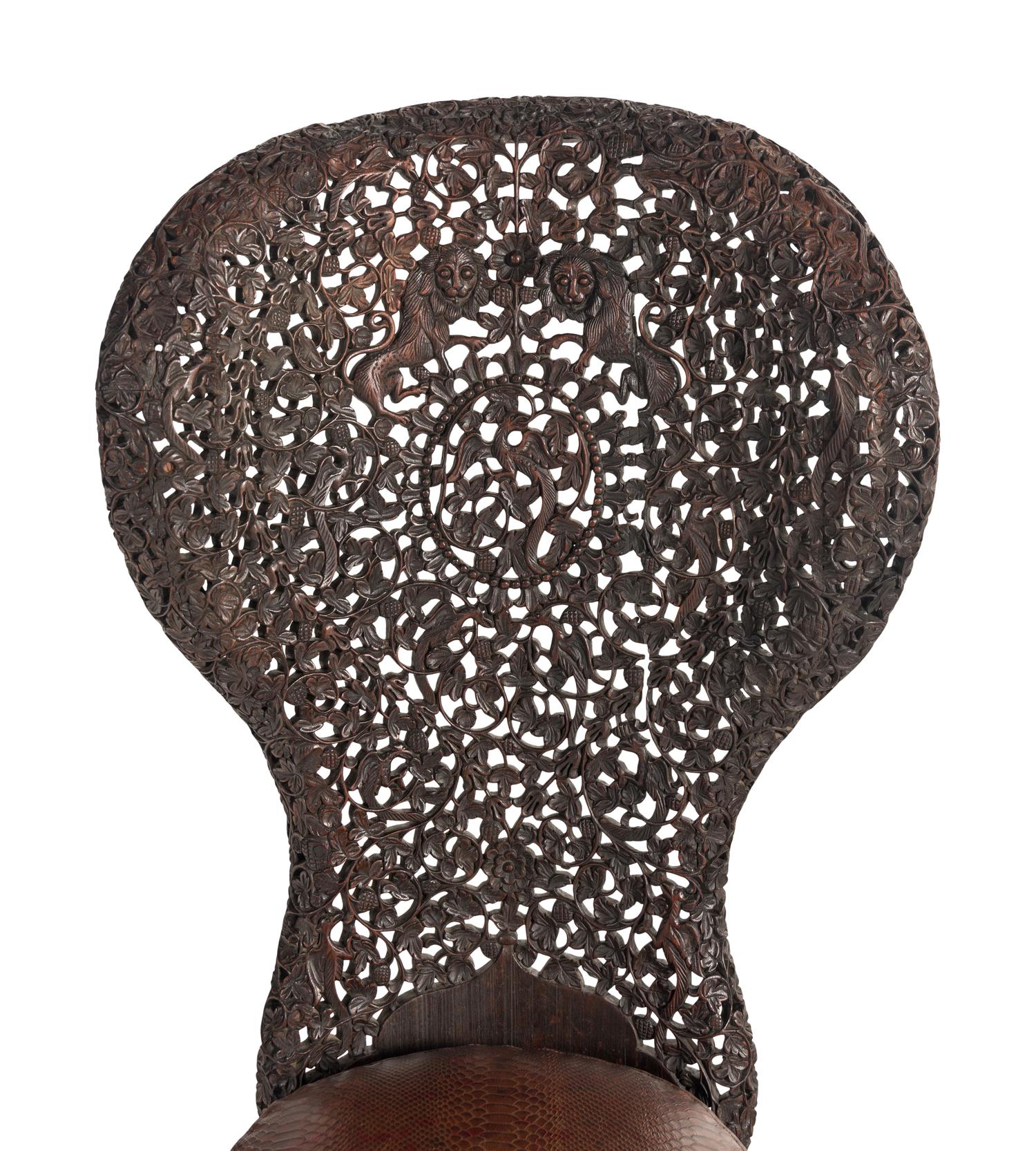 An Anglo-Indian Carved Hardwood Slipper Chair