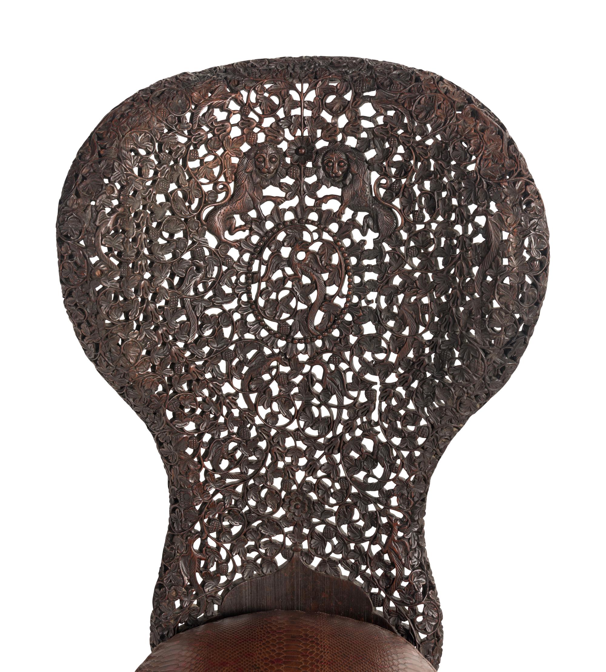 An Anglo-Indian Carved Hardwood Slipper Chair