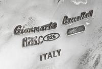 An Italian Silver Dish, Buccellati, Milan, Second Half 20th Century, in the form of a leaf, together with four silver-plate liquor tags
