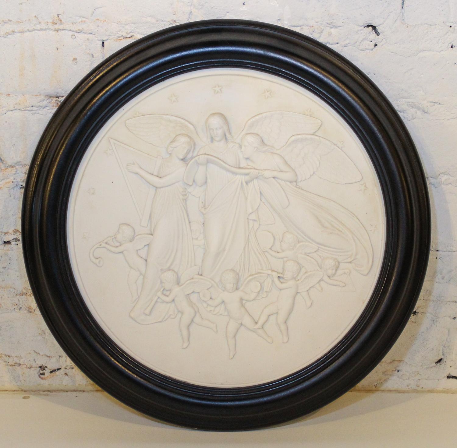 A Bisque Ceramic Relief Plaque. Diameter 12 3/4 inches.