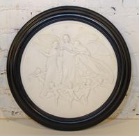 A Bisque Ceramic Relief Plaque. Diameter 12 3/4 inches.