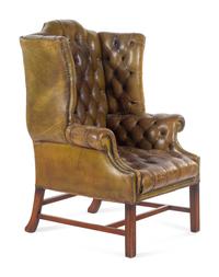 An English Leather Upholstered Mahogany Wingback Armchair