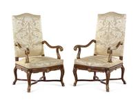 A Pair of Louis XV Style Carved and Parcel Gilt Walnut Fauteuils