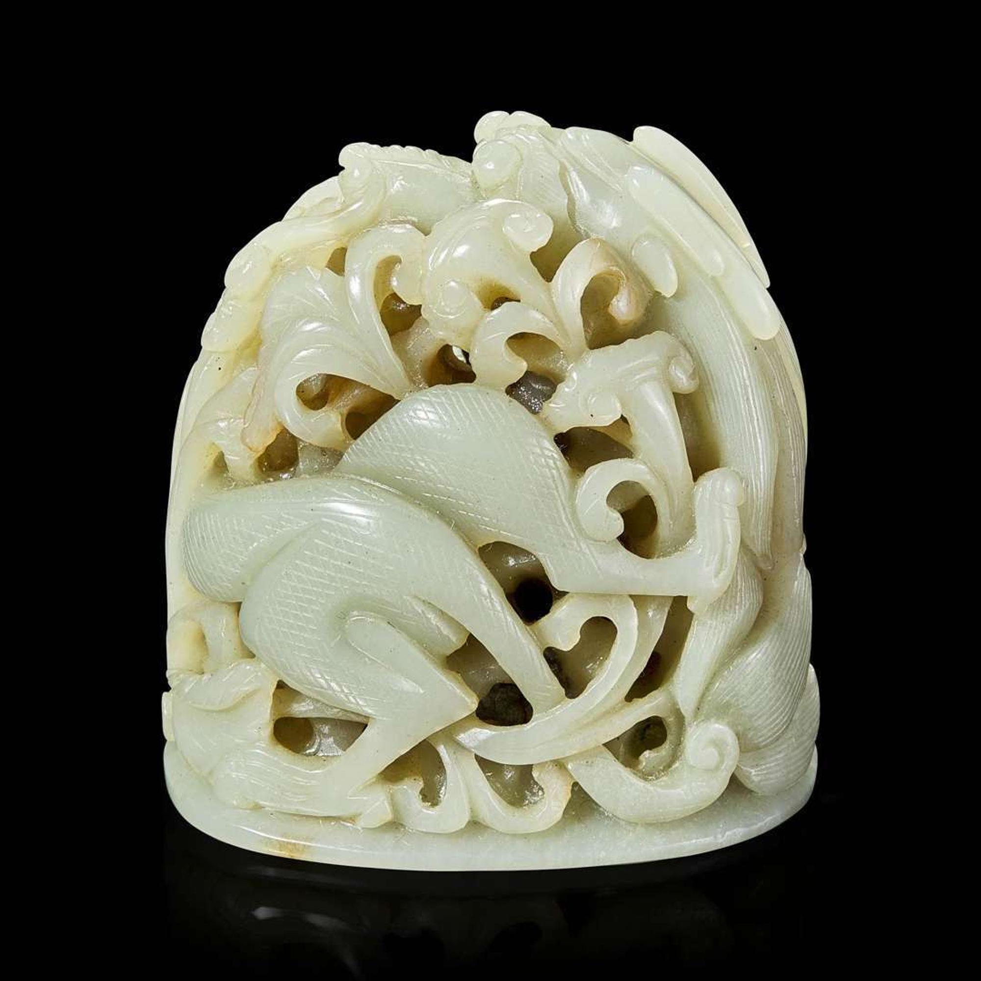 A Chinese pale celadon jade reticulated "Dragon" finial 青白玉镂空龙形炉端