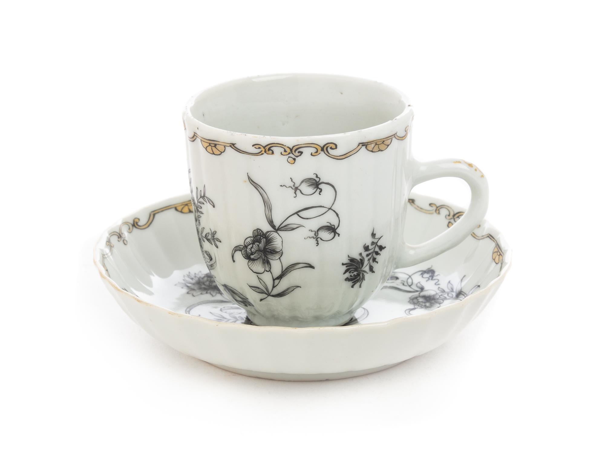 A Chinese Export Grisaille Porcelain Cup and Saucer Diameter of saucer 4 3/4 inches. — 19TH CENTURY
