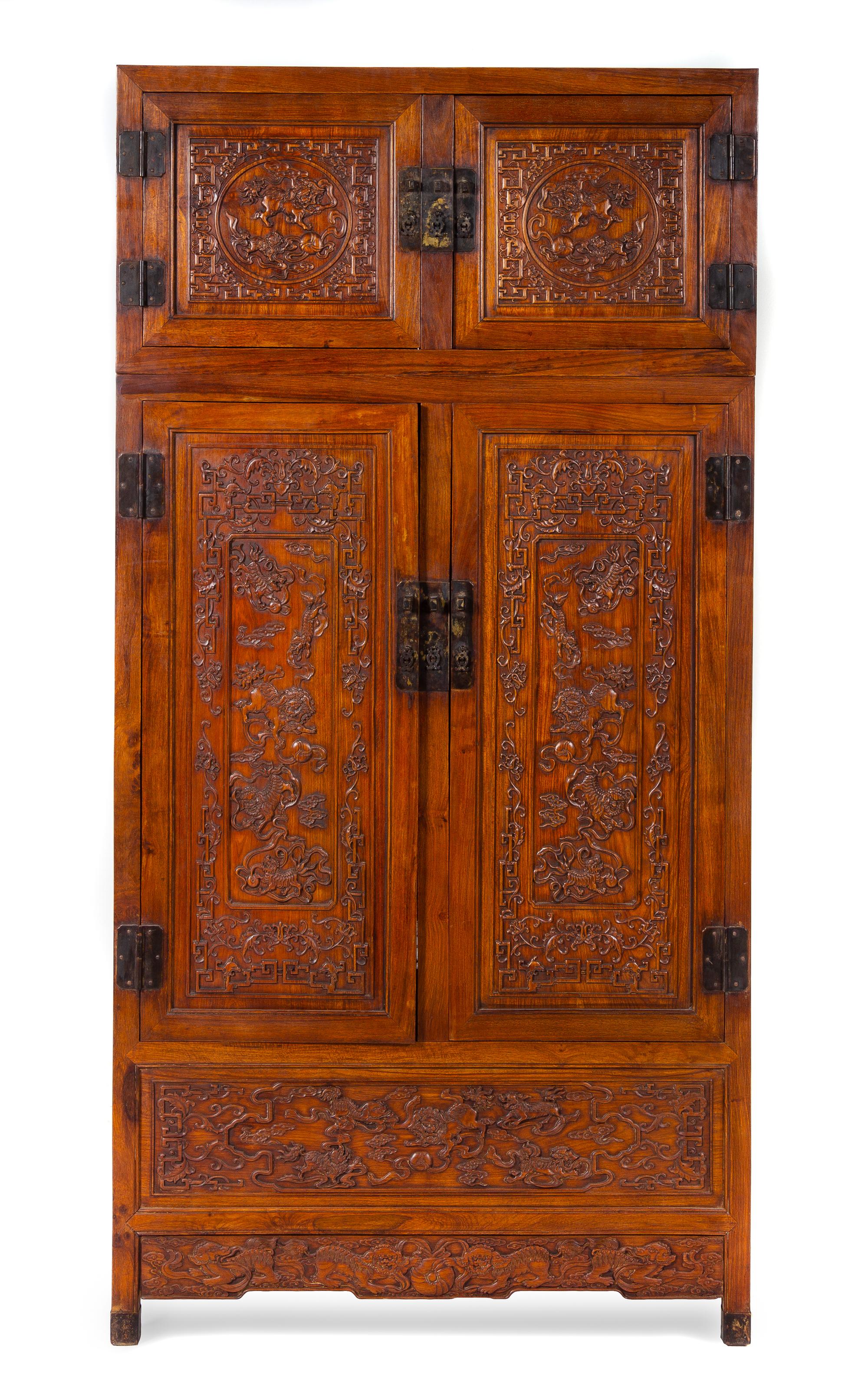 A Carved Hardwood Cabinet Height 79 x width 39 1/4 x depth 19 1/2 inches. — 20TH CENTURY