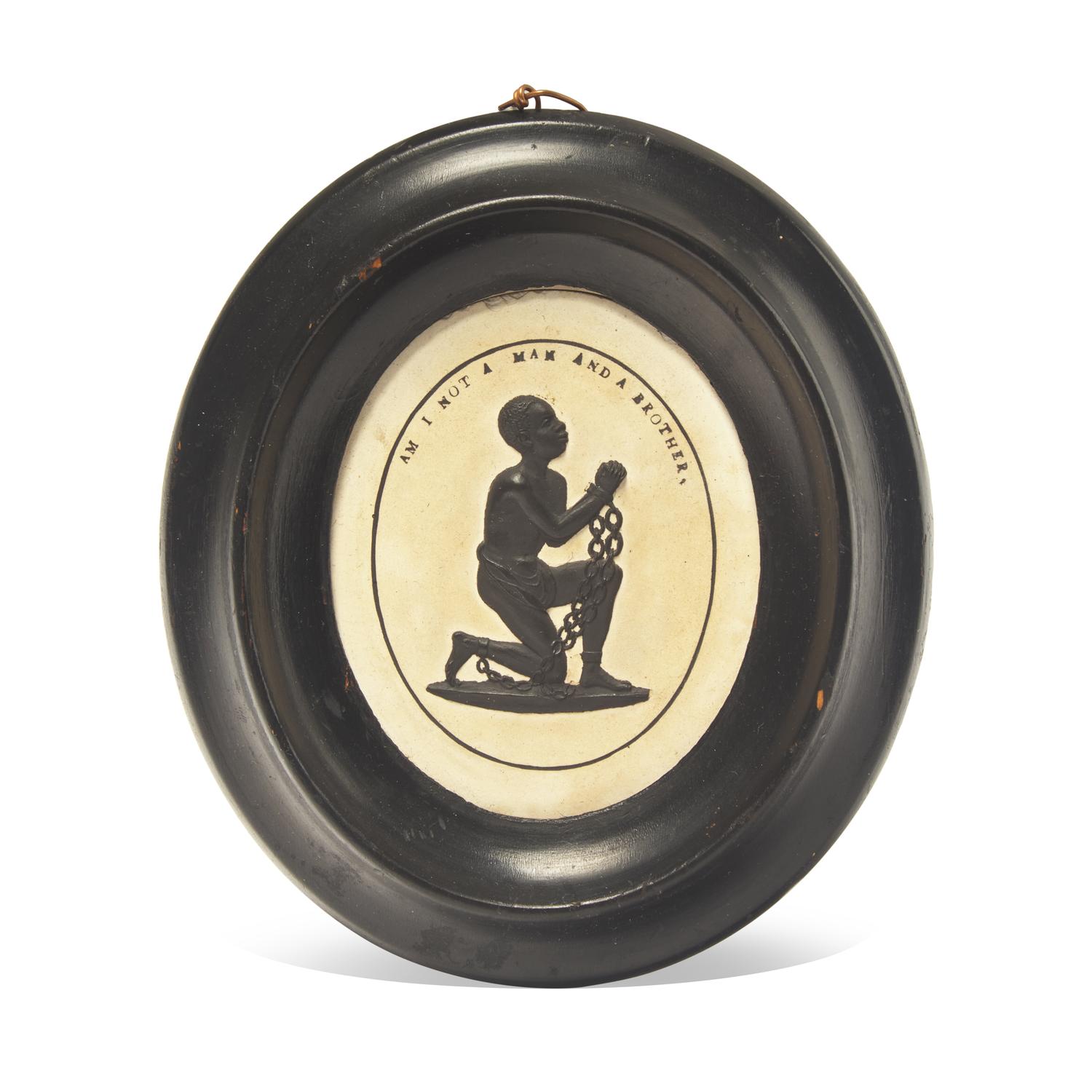 A Wedgwood Caneware and Black Basalt Oval Plaque: "Am I Not a Man and a Brother?"