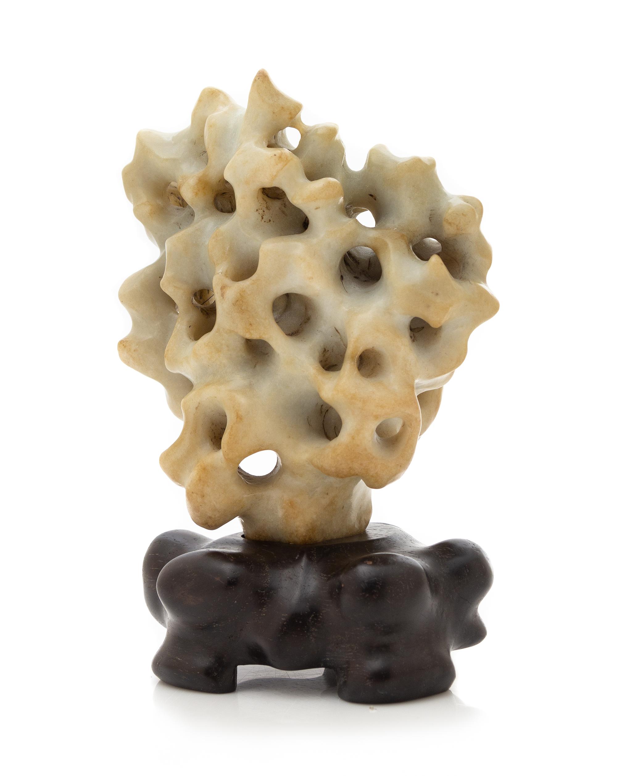 A Celadon Jade Scholar's Rock Height overall 7 1/2 inches. — 19TH CENTURY