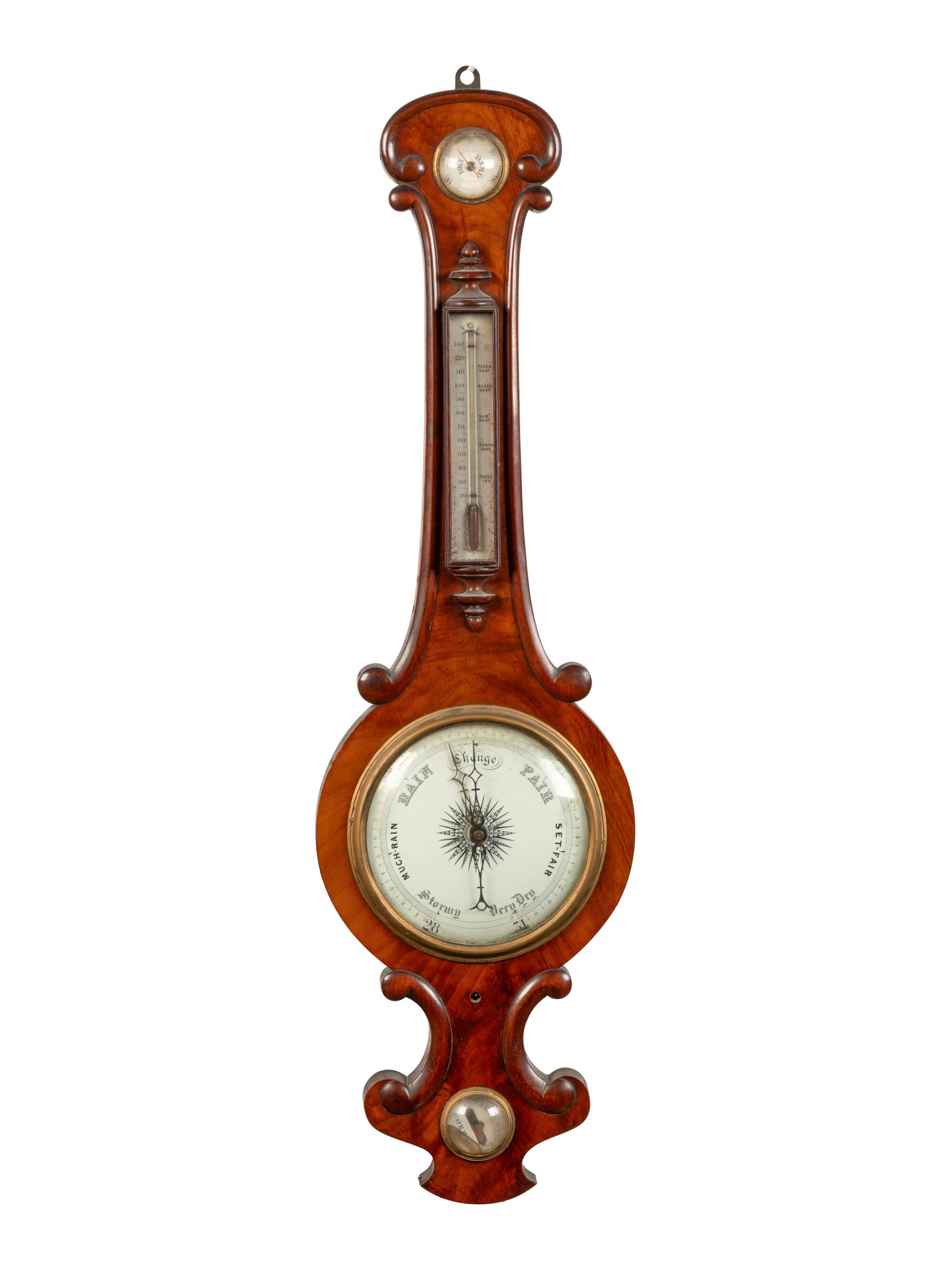 An English Mahogany Wheel Barometer and Thermometer