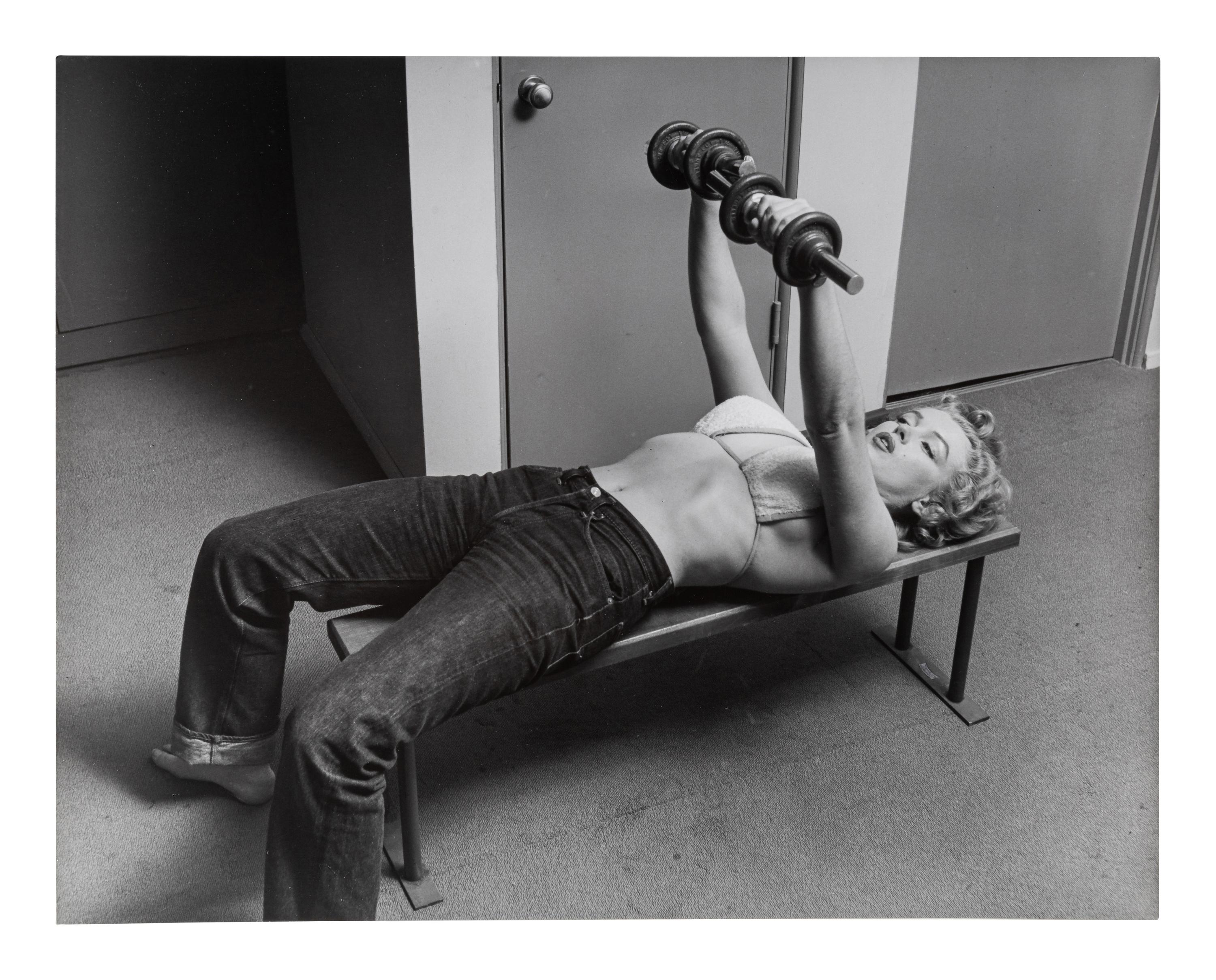 Philippe Halsman (1906-1979) Marilyn Monroe Lifting Weights, 1952