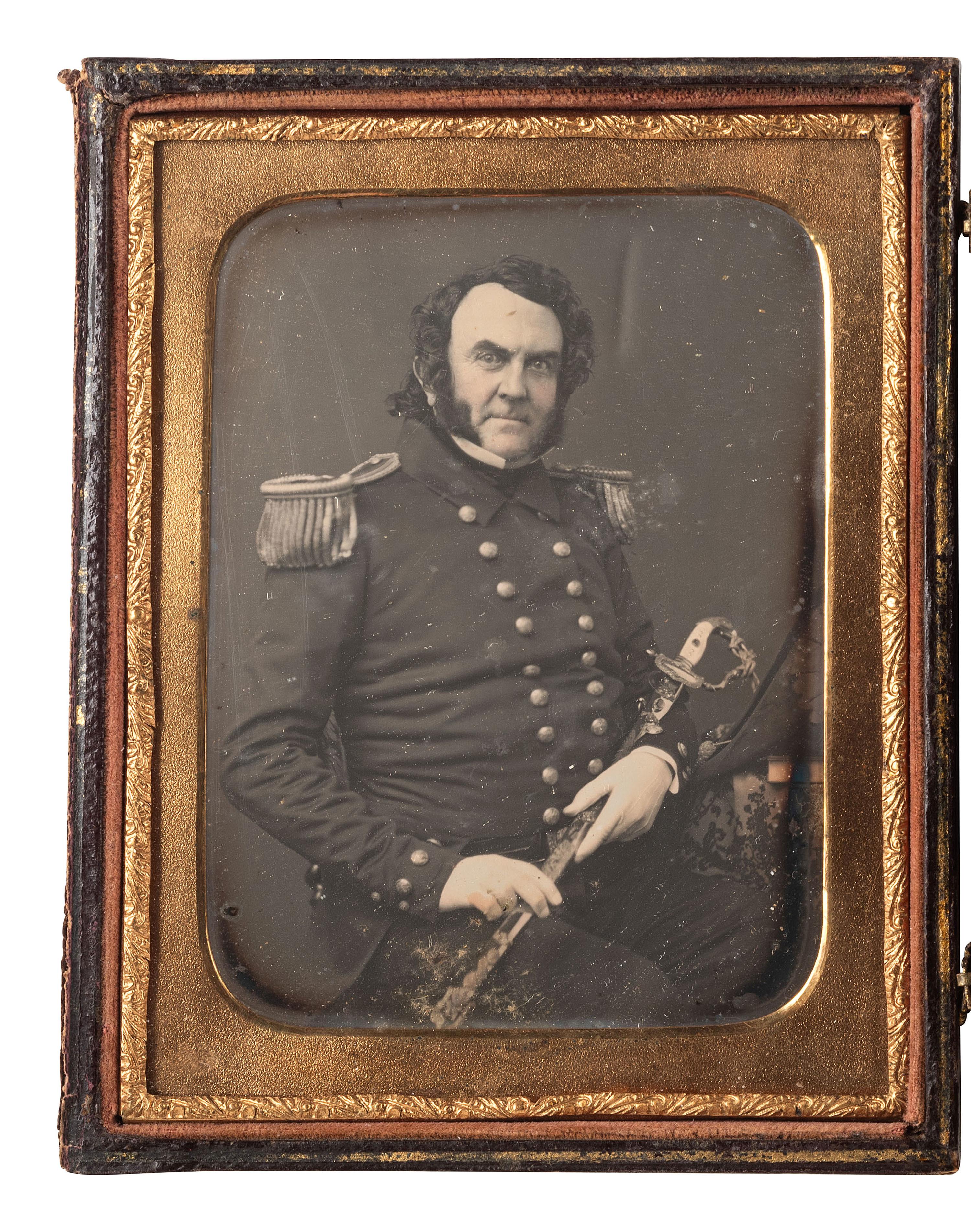 [MEXICAN WAR]. Quarter plate daguerreotype portrait of Thompson Darrah Shaw, USN, with sword presented to him for gallantry at Veracruz, 1847.