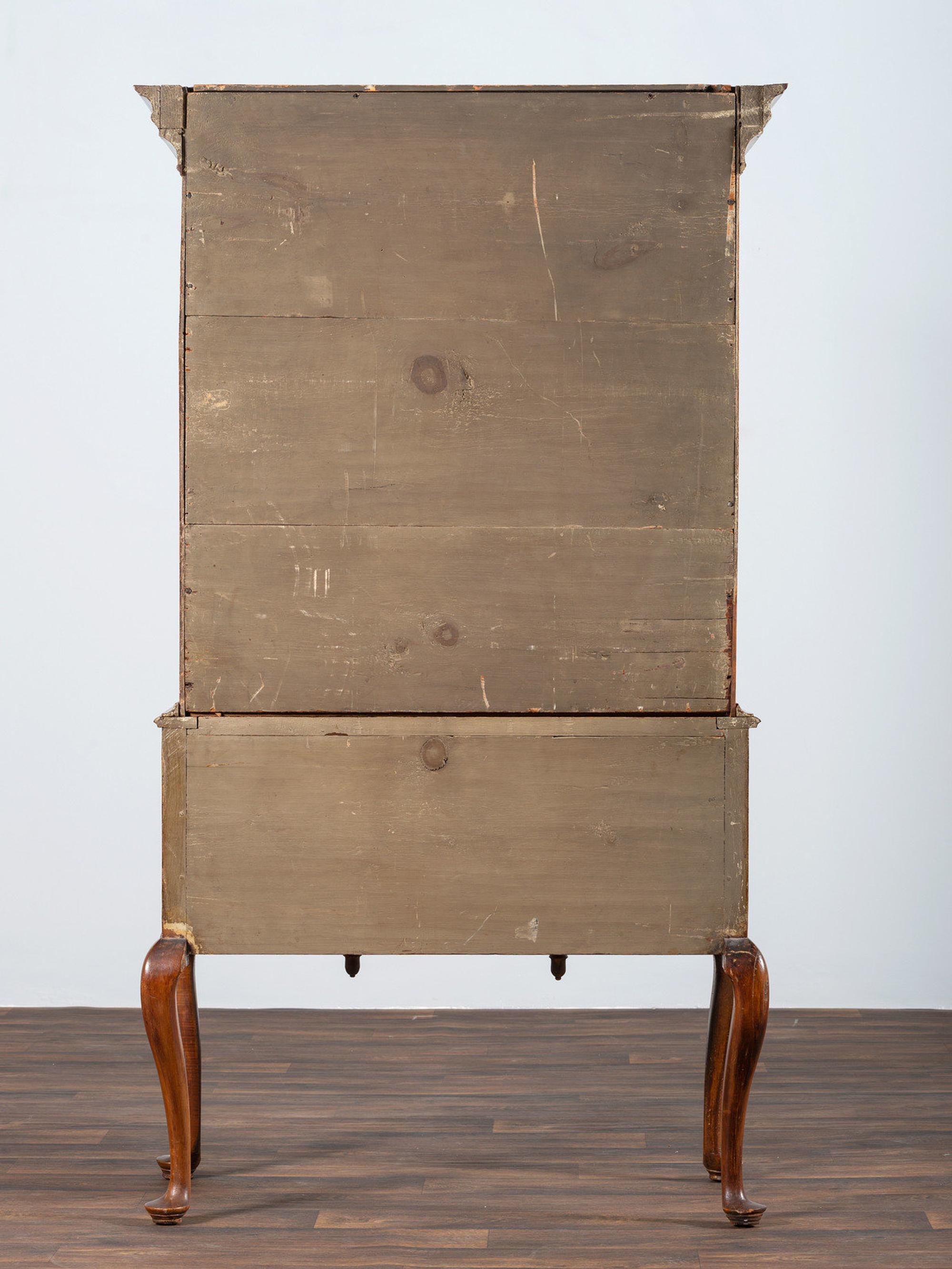 A Queen Anne Shell-Carved and Figured Maple Flat-Top High Chest of Drawers