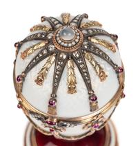 A 14 Karat Vari-Color Gold, Silver, Guilloché Enamel, Diamond, Pearl, and Cabochon Jewel-Mounted Surprise Egg