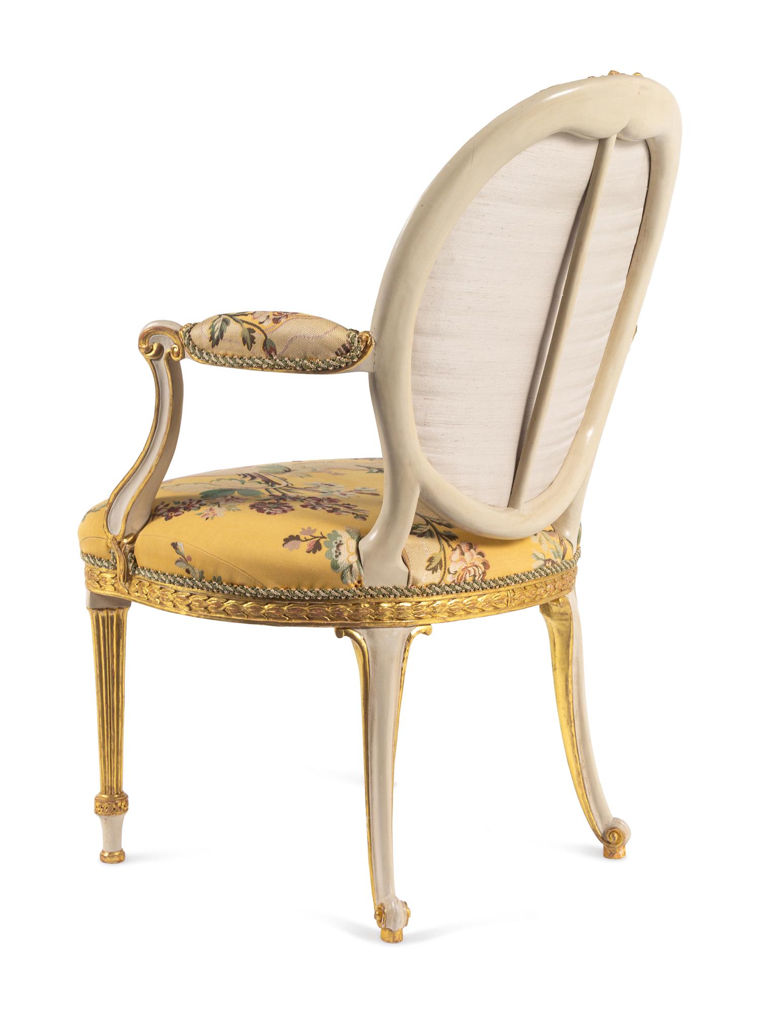 A George III White-Painted and Parcel-Gilt Open Armchair