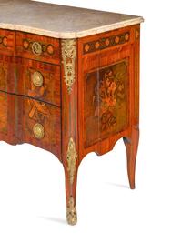 A Louis XV/XVI Transitional Style Gilt Metal Mounted and Sans Traverse Marquetry Marble-Top Commode