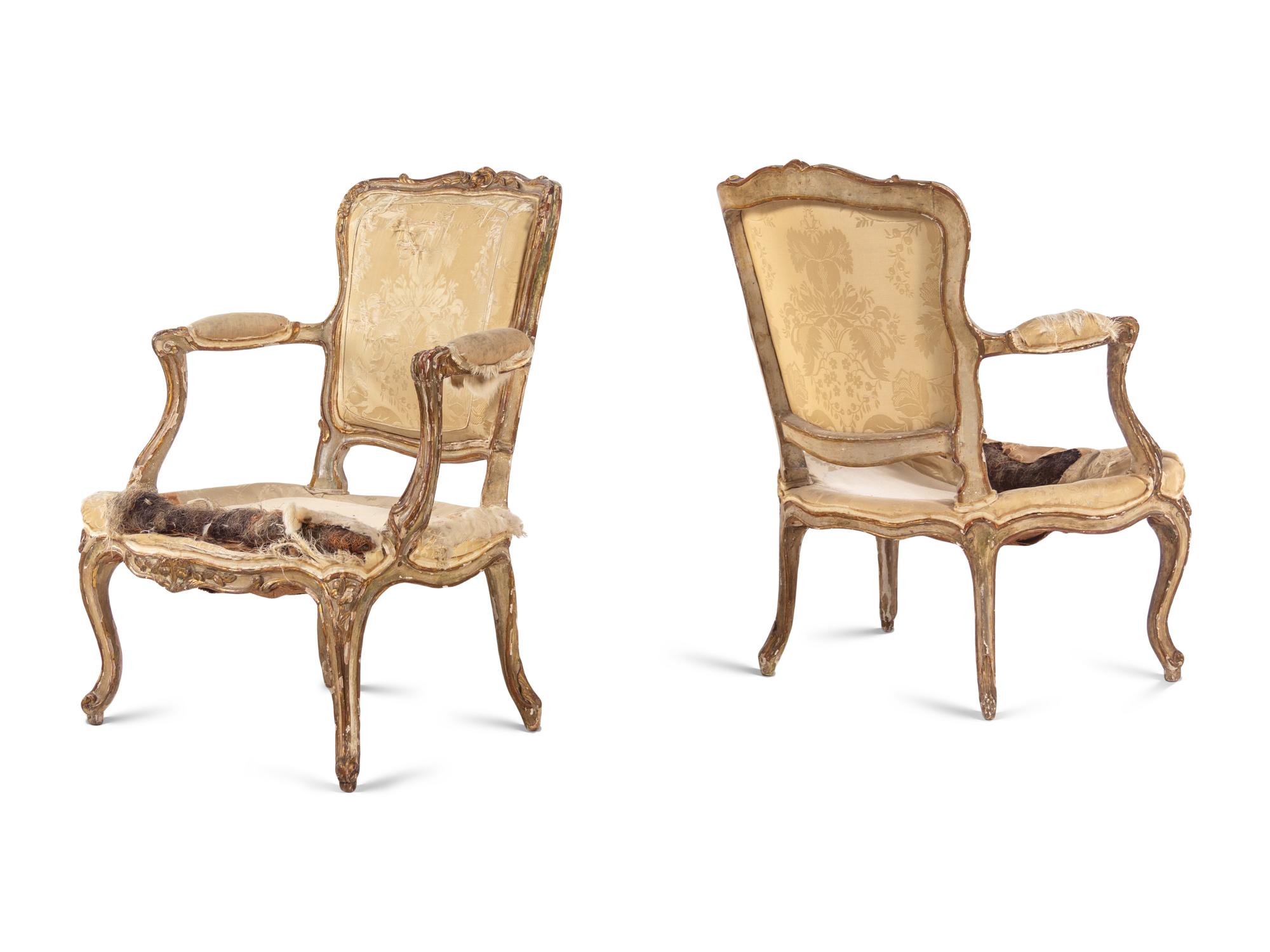 A Pair of Louis XV Parcel Gilt Fauteuils