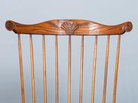 A D.R. Dimes Benchmark Turned and Volute Carved Tiger Maple and Pine Comb-Back Windsor Armchair