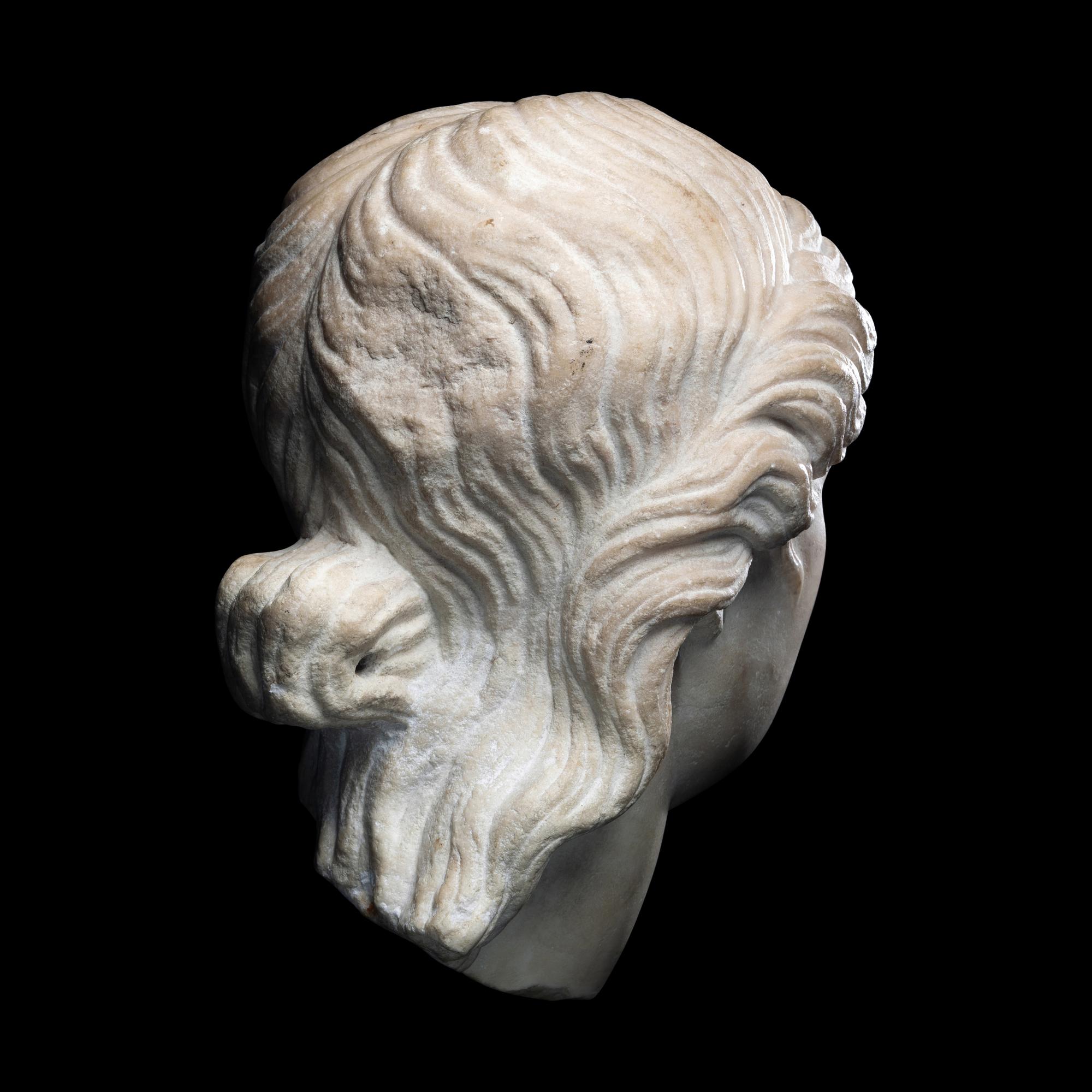 A Roman Marble Head of a Goddess or Youthful God