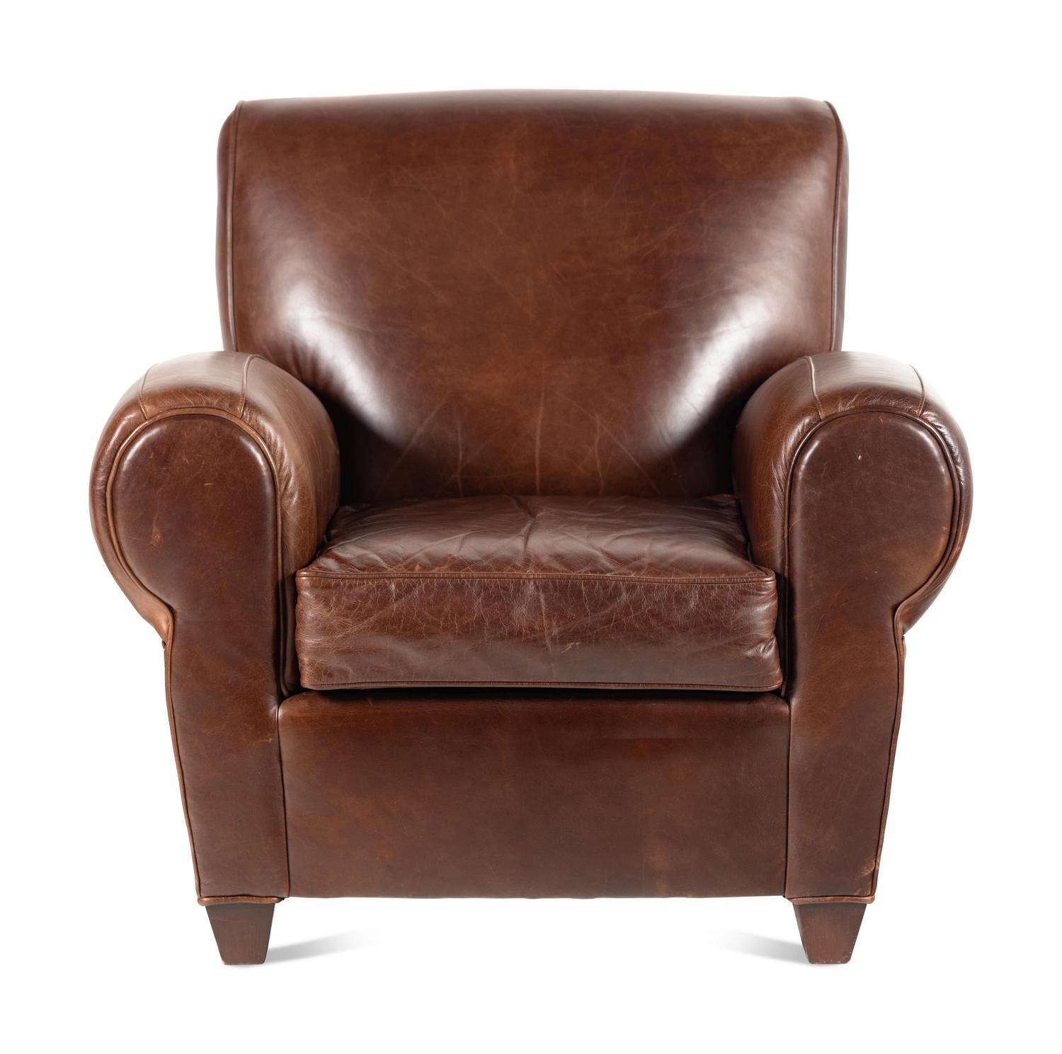 A Contemporary Leather-Upholstered Lounge Chair and Ottoman