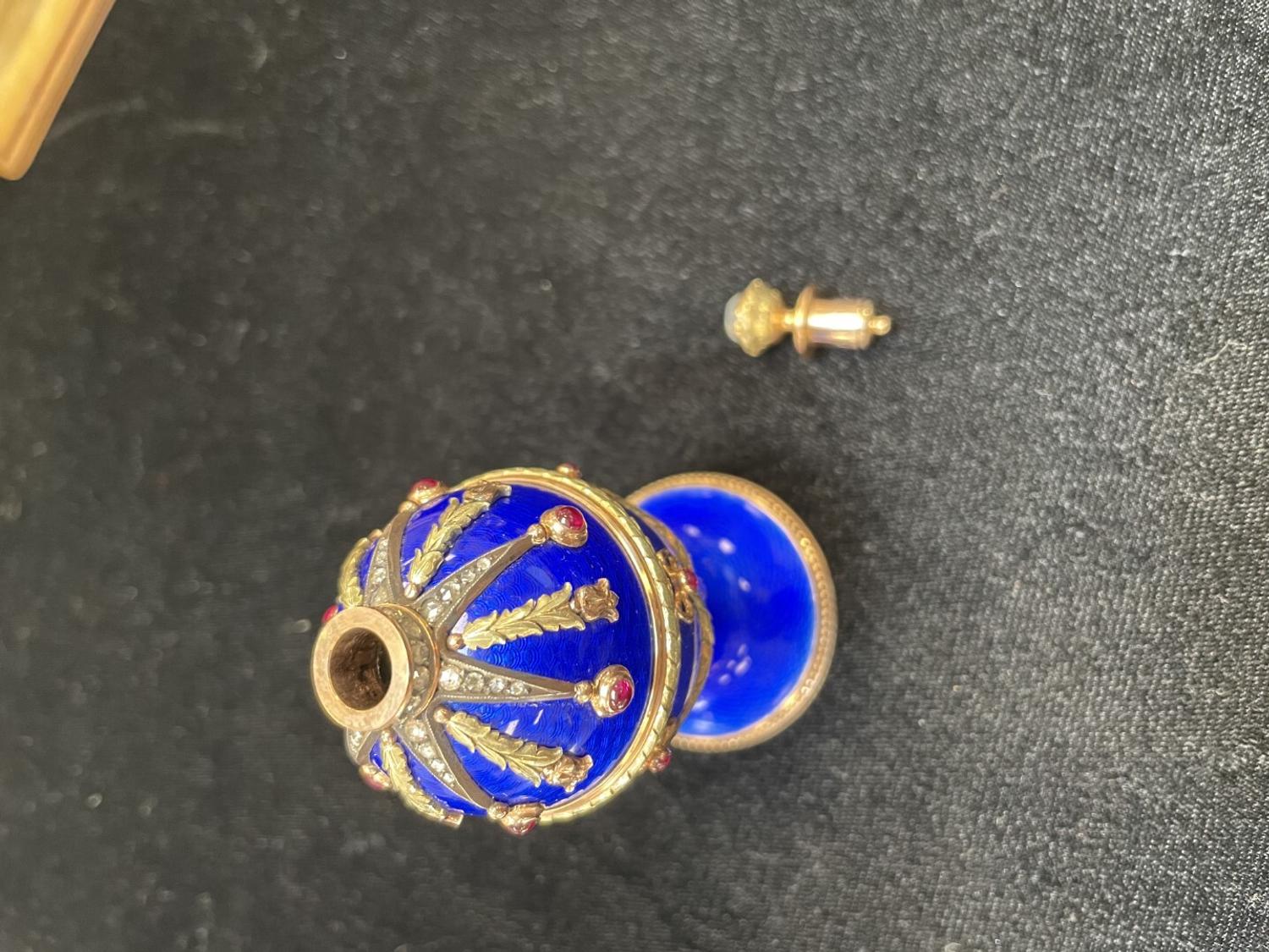 A 14 Karat Vari-Color Gold, Guilloché Enamel, Diamond, and Cabochon Jewel-Mounted Egg-Form Perfume and a Related Guilloché Enamel, 14 Karat Vari-Color Gold, Diamond, and Cabochon-Mounted Surprise Egg