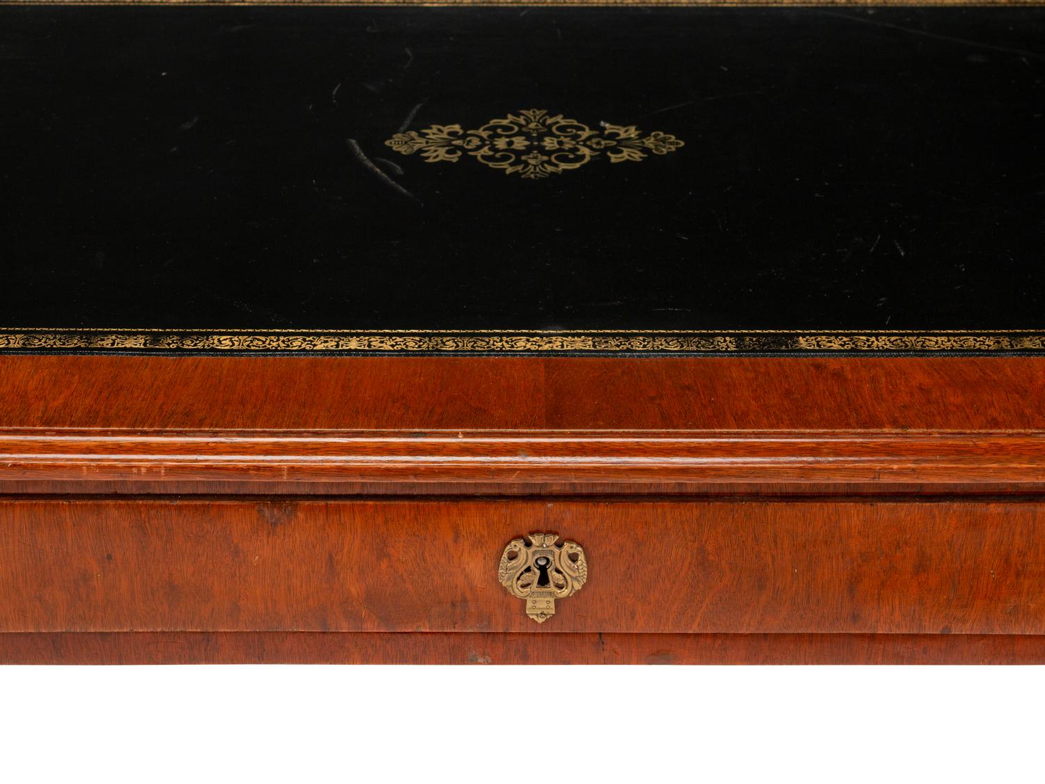 A Baltic Neoclassical Style Mahogany Desk and Chair