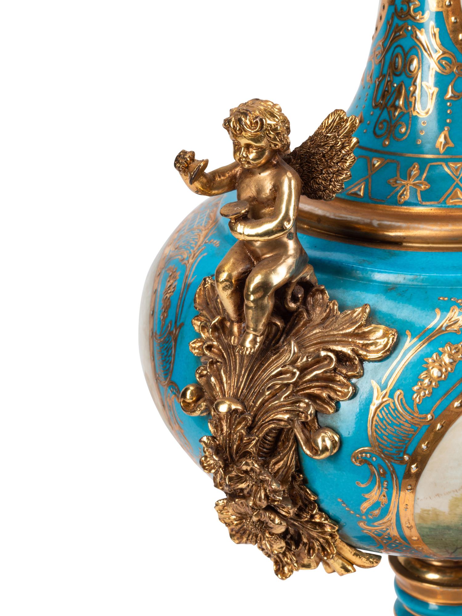 A Pair of Gilt Bronze Mounted Sèvres Style Porcelain Vases and Covers
