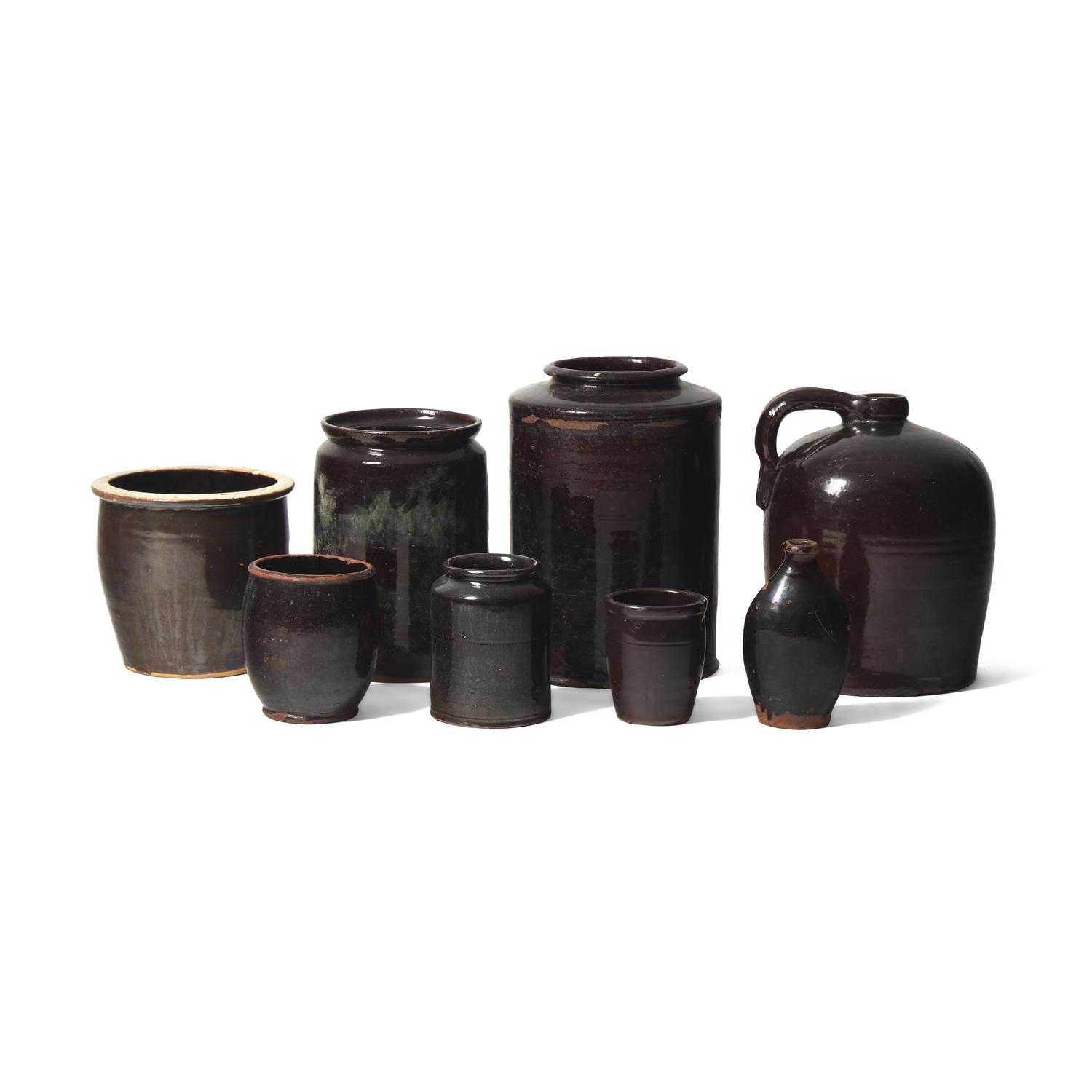 A Group of Eight Albany Glazed Redware Items