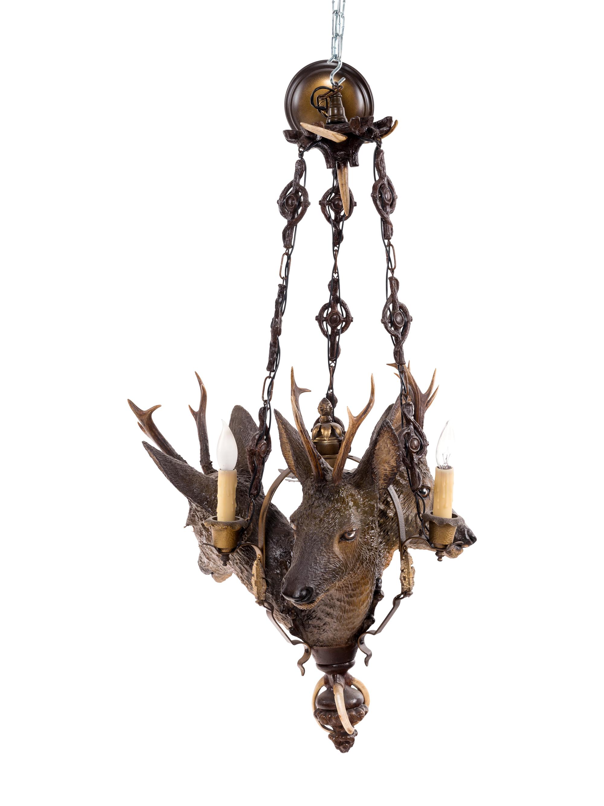 A Black Forest Style Composite Three-Light Chandelier