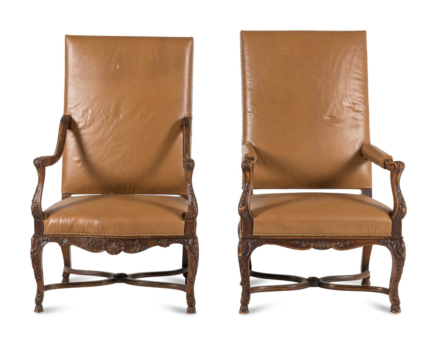 A Matched Pair of Régence Style Walnut Fauteuils