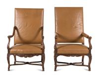 A Matched Pair of Régence Style Walnut Fauteuils