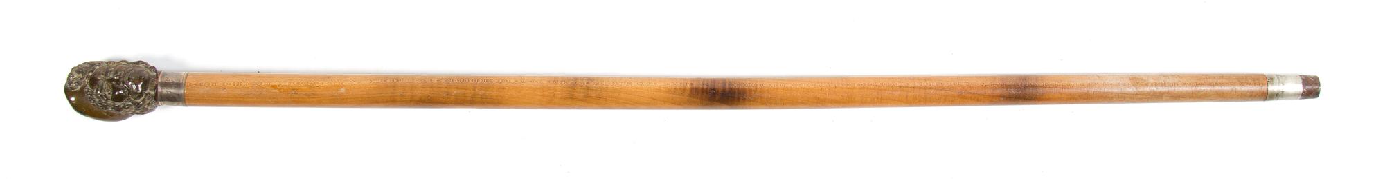 A Carved Horn and Wood Walking Stick, Height overall 35 1/2 inches.