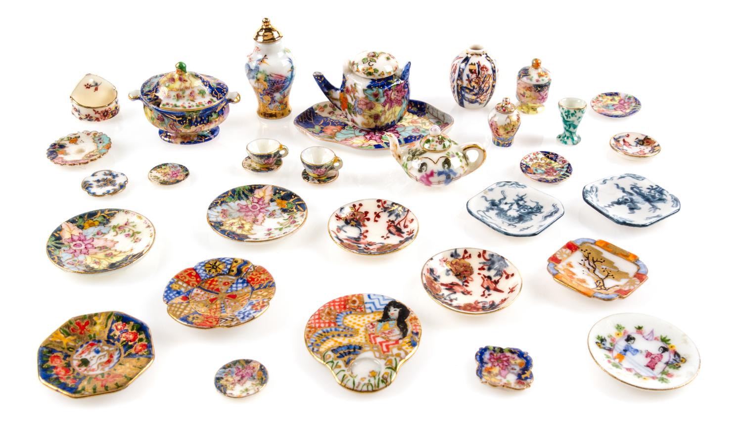 A Collection of Porcelain Table Articles Width of oval platter 1 3/4 inches. — Ina Williams