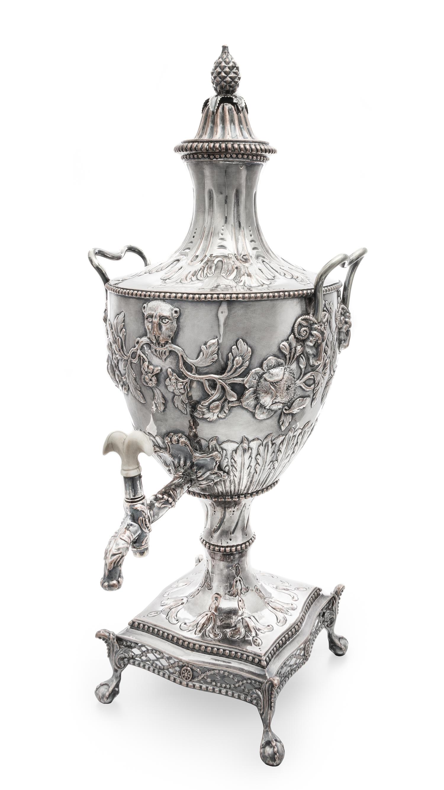 A George III Silver-Plate Hot Water Urn, Sheffield, Late 18th Century, the domed reeded cover with a pinecone finial, the baluster form